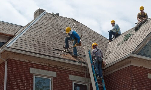 Roofers Repairing Roof