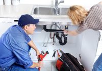 Plumber with customer